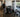 Organized commercial gym floor with compact core training equipment, open workout space, benches, and accessible storage