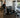 Organized commercial gym floor with compact core training equipment, open workout space, benches, and accessible storage
