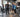 Older adults using a senior-friendly strength machine circuit in a modern commercial gym