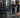 Busy commercial strength training area designed for heavy student traffic with racks, storage, and durable flooring