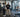 University strength coach reviewing commercial racks, benches, and free weights in a professionally equipped school weight room