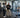 University strength coach reviewing commercial racks, benches, and free weights in a professionally equipped school weight room