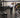 Clean firehouse or police department fitness room with commercial strength equipment, functional training space, and durable gym flooring