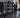Organized functional training area with battle ropes, sleds, resistance bands, and medicine balls stored efficiently