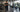 Gym facility manager tracking machine usage on a clean fitness floor with commercial strength equipment