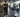 Gym facility manager tracking machine usage on a clean fitness floor with commercial strength equipment