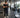 Gym facility manager tracking machine usage on a clean fitness floor with commercial strength equipment