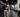 Modern gym layout with cameras, bright lighting, clear walkways, and organized strength equipment for improved facility safety