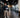 Modern gym layout with cameras, bright lighting, clear walkways, and organized strength equipment for improved facility safety