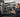 Organized gym rack area with attachment storage solutions for cable handles and accessories
