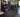 Personal trainer coaching a varied strength session with cable equipment, dumbbells, and functional training tools