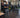 Personal trainer coaching a varied strength session with cable equipment, dumbbells, and functional training tools