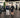 Gym owner reviewing a strength equipment layout organized by muscle group on a clean commercial training floor