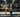 Gym owner using bird dog exercise for lower back stability