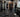 Trainer using adjustable benches, cable equipment, and dumbbells on a versatile commercial strength floor