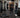 Trainer using adjustable benches, cable equipment, and dumbbells on a versatile commercial strength floor