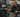 Gym member using a selectorized weight stack machine with a reminder to lower the stack gently
