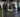 Athletes training with sleds, power racks, lifting platforms, and cable stations in a performance gym