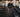 Urethane dumbbells organized in a busy commercial gym strength training area