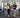 Employees using approachable cardio and strength equipment in a modern workplace gym